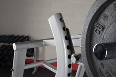 Close-up of PROCLUBLINE LEVERAGE CALF SQUAT with adjustable weight plate holder, showcasing its sturdy design.