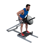 Man performing T-bar row exercise on Body-Solid Pro Clubline STBR500 Row Machine with weights.