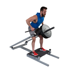 Man performing T-bar row exercise on Body-Solid Pro Clubline STBR500 Row Machine with weights.