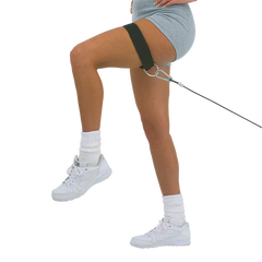 Woman using adjustable combo thigh/ankle strap for hip and thigh workouts, improving strength and conditioning.