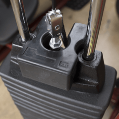 5 lb. weight stack adapter plate securely attached to a machine weight stack, showcasing its robust design made from virgin rubber.